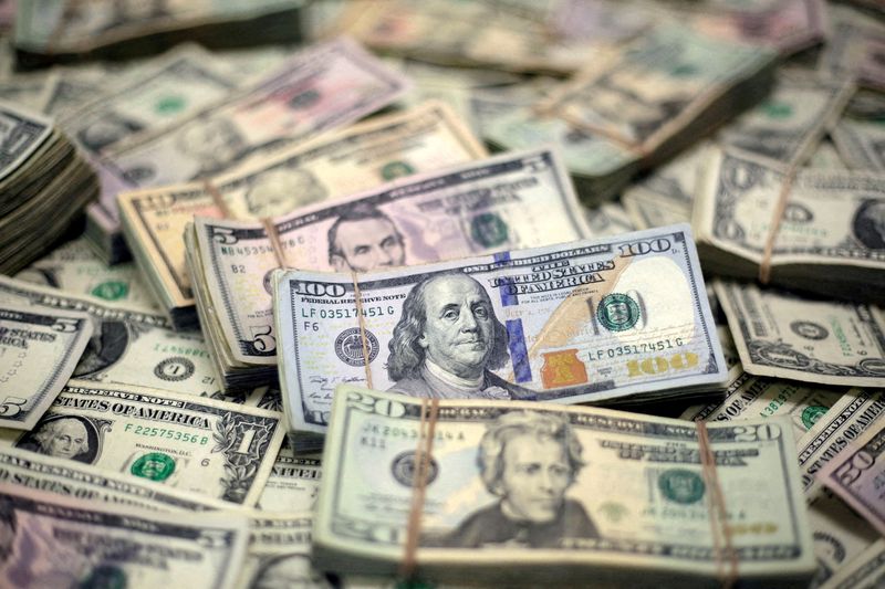 Dollar slips as traders unwind Trump trades before election